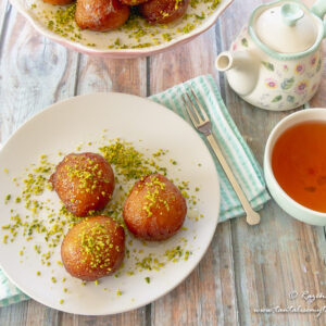 Cardamom bollas with saffron syrup