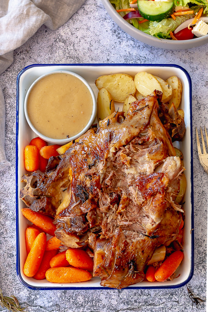 Slow cooked pulled lamb shoulder with veg and salad